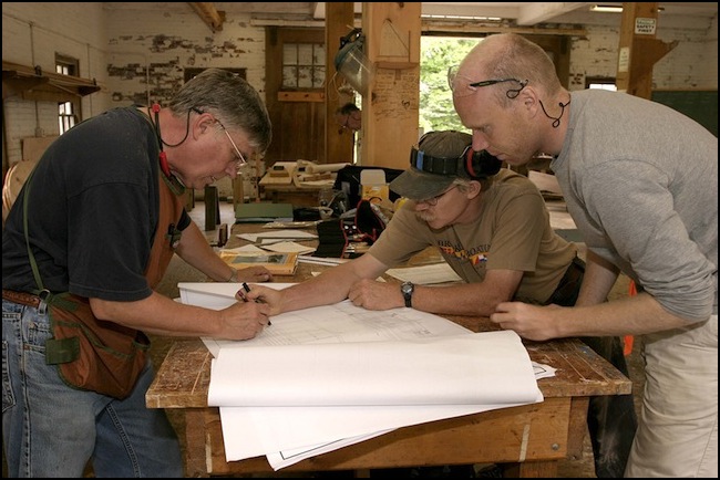 WoodenBoat School going over the plans